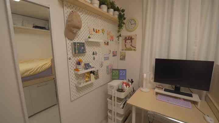 Natural-tone compact studio apartment home office featuring desk, full-length mirror, and gap storage creating cozy interior