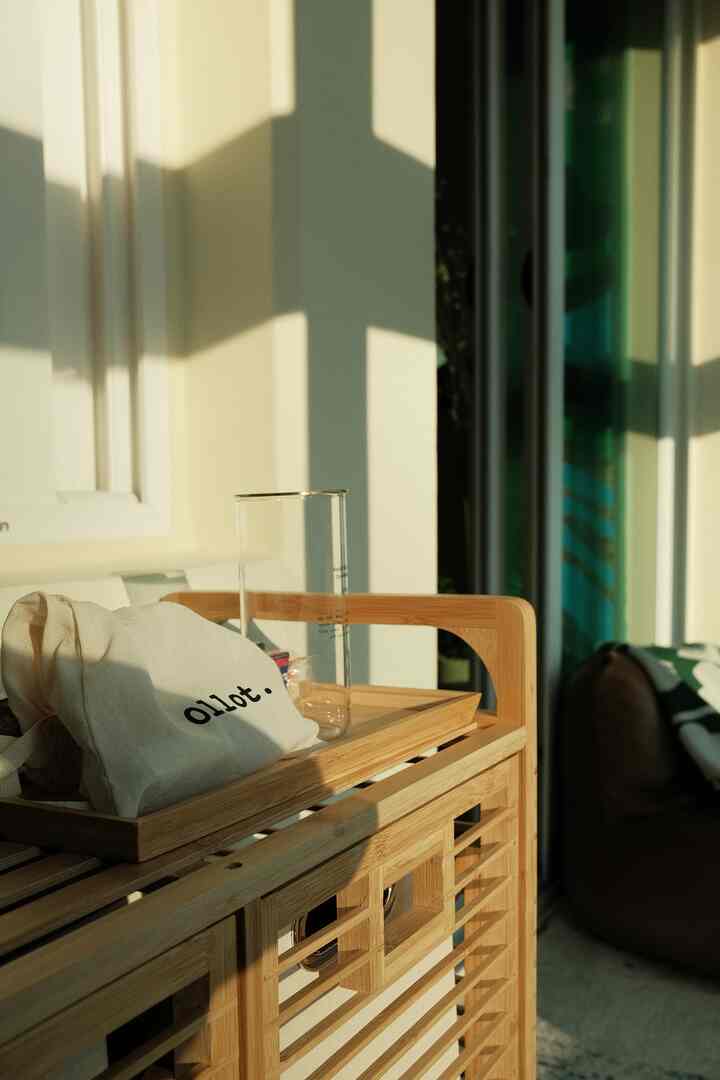 Natural color and brown toned veranda featuring bamboo storage basket and bean bag sofa bathed in warm sunlight, creating a cozy relaxation space