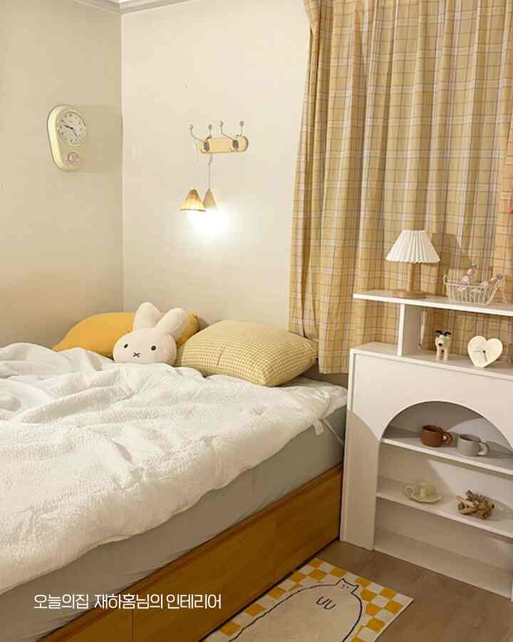 Natural modern single bedroom with yellow check curtains, white bedding, and cute cushions creating a cozy and warm atmosphere