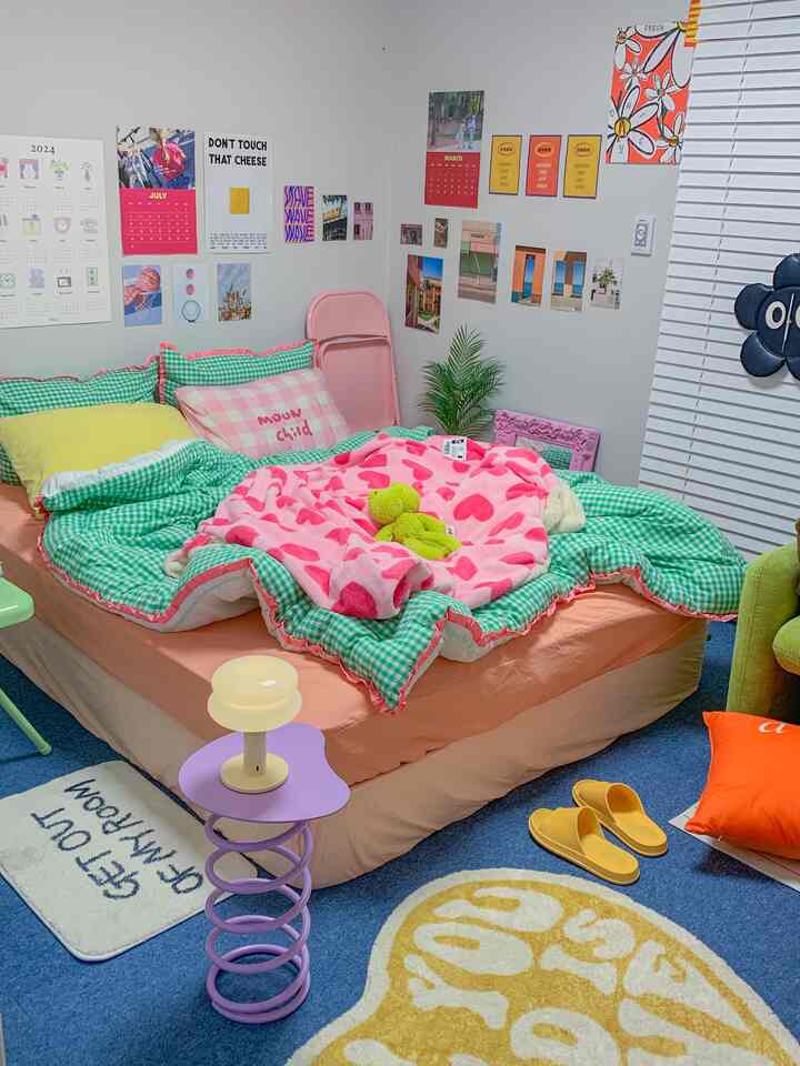 Pastel-toned bedroom featuring pink and green duvet covers and blankets, creating a cozy atmosphere