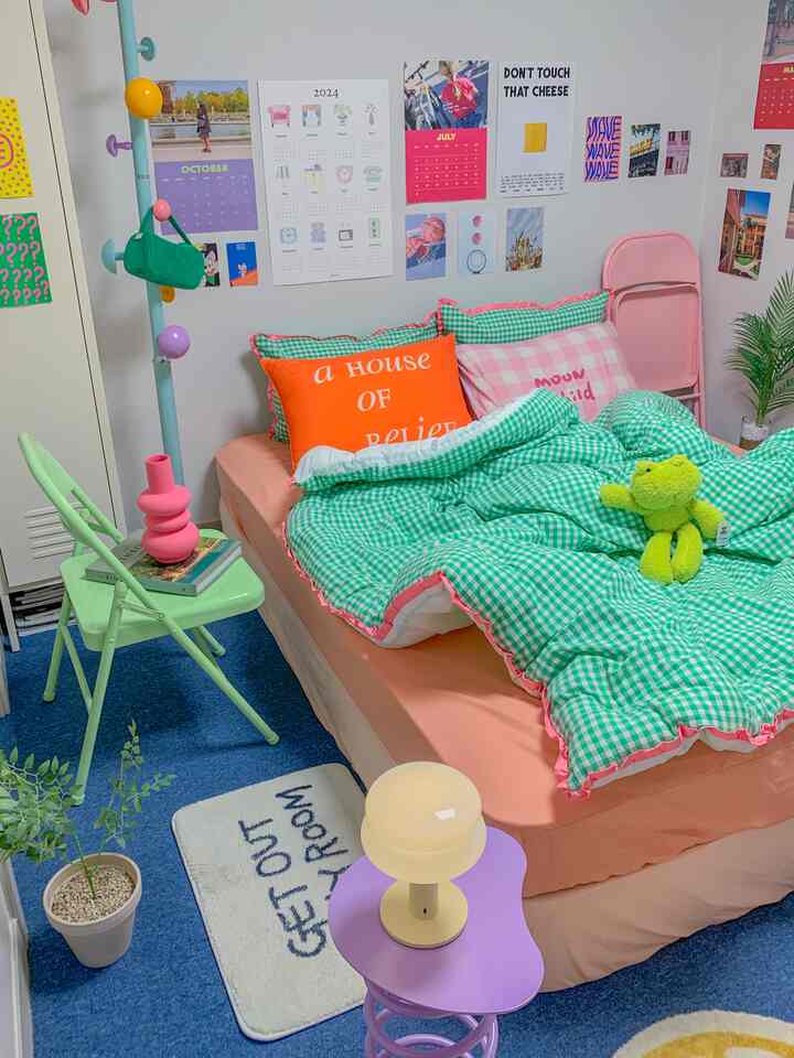 A studio bedroom featuring bright green and pink tones, checkered bedding, and charming personal decorations creating a cozy atmosphere