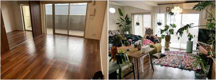 ダークブラウンの床とドア、グレーの壁に多彩な植物が配置された印象的なリビング空間