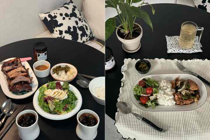 白と黒の色調のダイニング空間、テーブルクロスやカトラリー、器が配された清潔感のある自然な雰囲気のインテリア