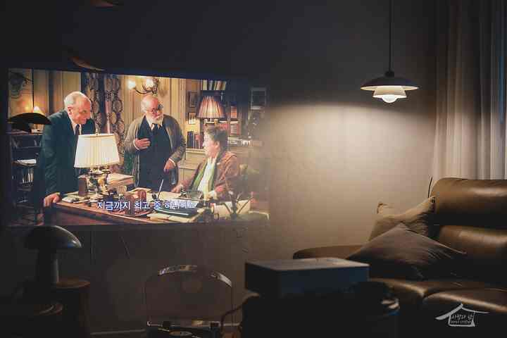 Brown leather sofa and blackout curtains in living room home cinema space