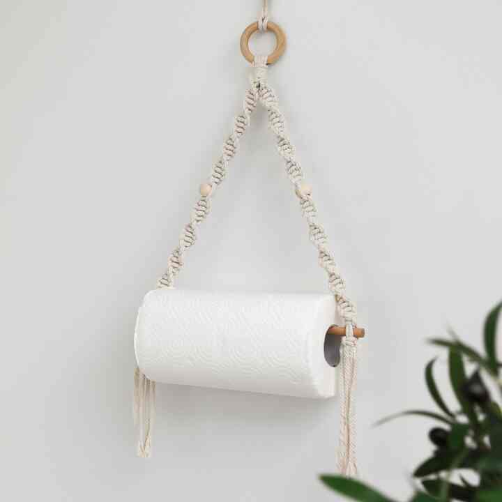 Natural tone wall with deep beige cotton rope macrame kitchen towel and tissue holder hanging decor