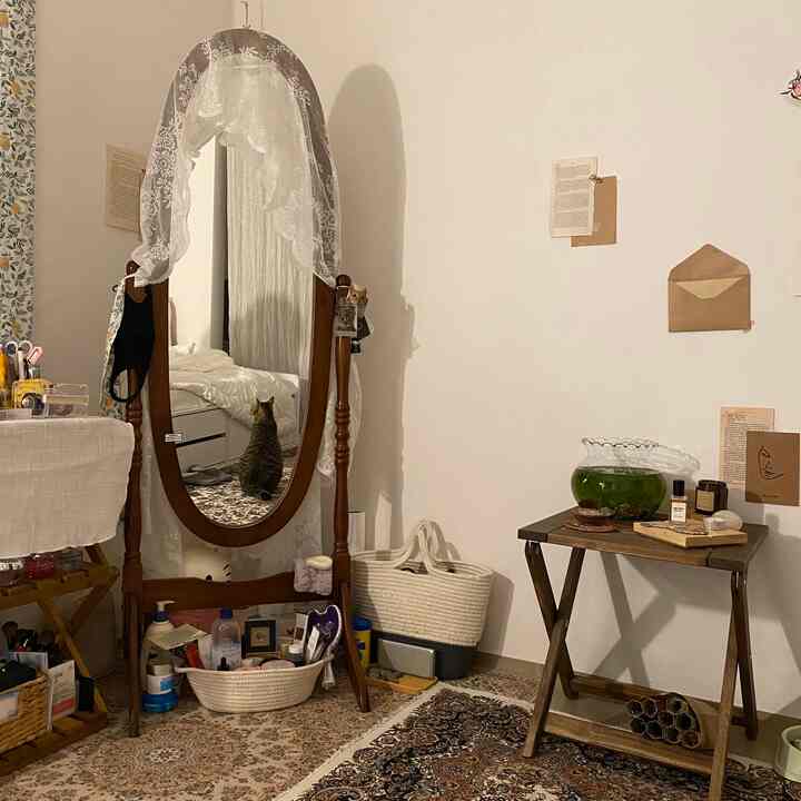 Cozy vintage-style space featuring beige tones, wooden mirror, and Persian carpets