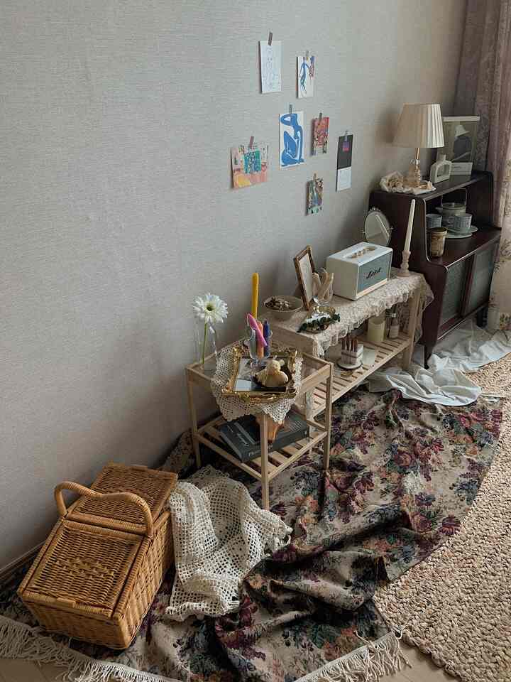Cozy home cafe style nook featuring natural wood tones, decorative rugs, and assorted charming objects arranged on shelves