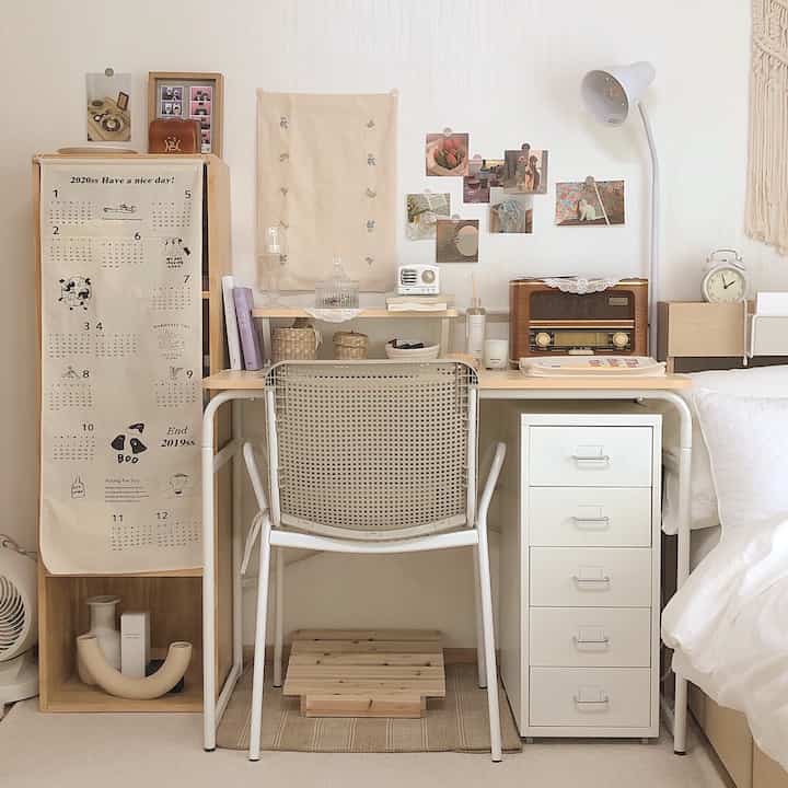 Warm natural-toned bedroom space featuring a desk and office chair arranged in a cozy home office setup