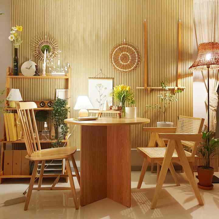 Cozy home cafe space featuring warm wood tones, round table, wooden chairs, and plants creating a natural ambiance