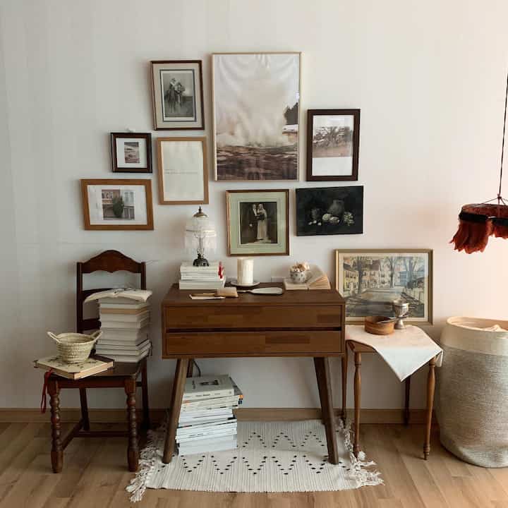Cozy living room with natural wood tones and vintage picture frames