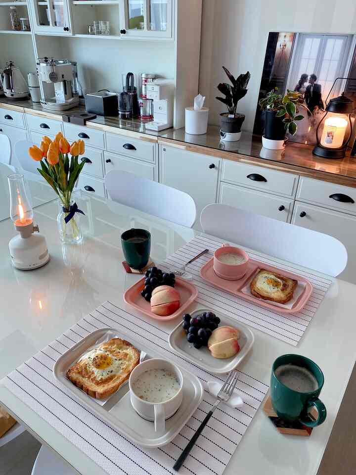 White and wood tone living room home cafe featuring coffee machines and a brunch dining table with a cozy atmosphere