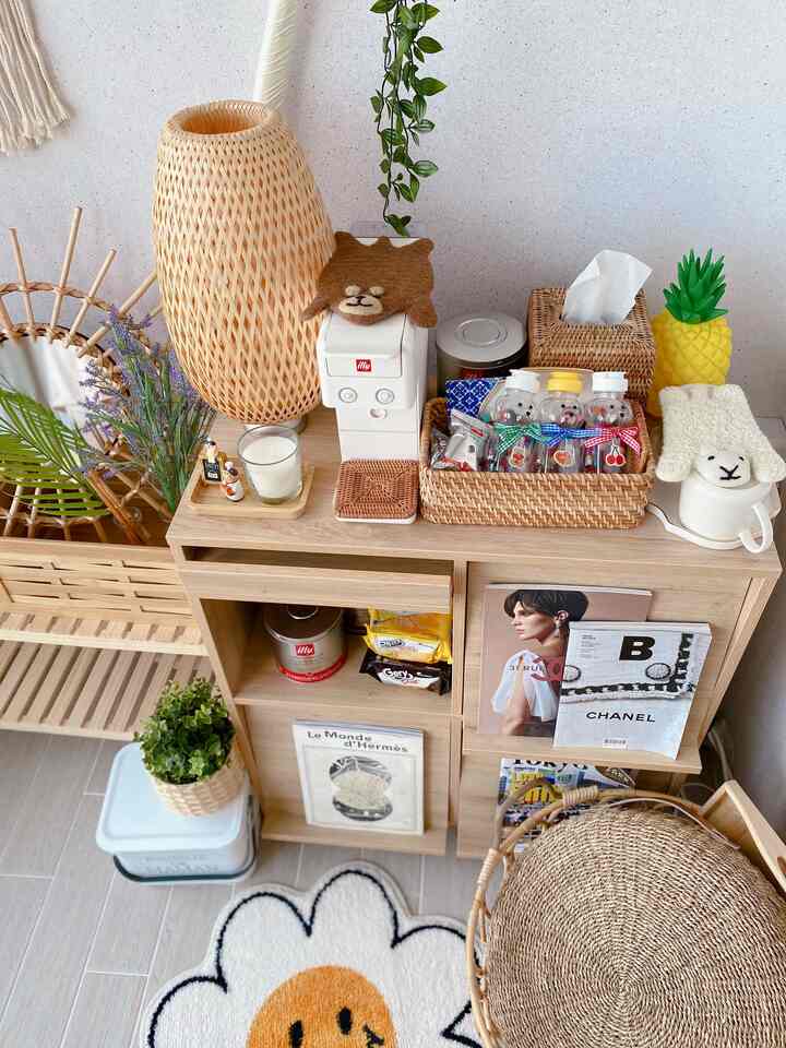 Natural-toned veranda home cafe space with neatly arranged rattan storage and coffee machine