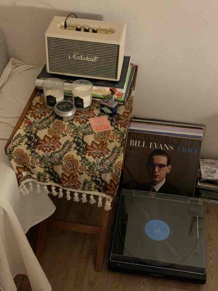 Warm brown tones with vintage-style items on a music listening table space