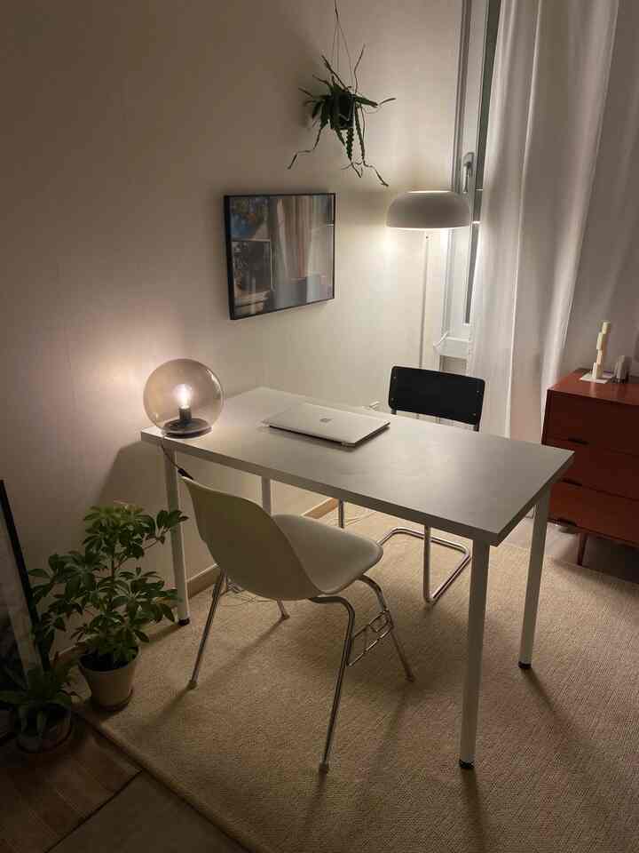 Beige-toned natural home office space featuring a desk and chairs with a cozy working atmosphere