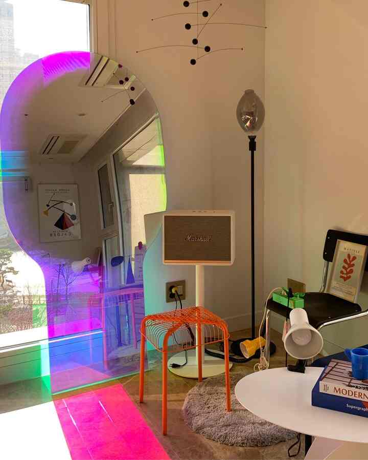 Bright and cozy living room home cafe corner featuring colorful accents and retro-style furniture