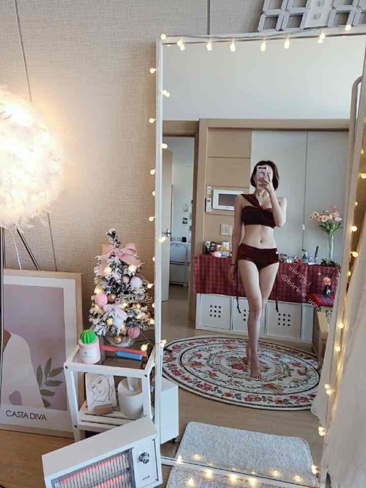 White and brown toned living room featuring a Persian rug and full-length mirror, creating a cozy and classic atmosphere