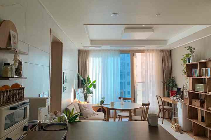Bright and cozy living room featuring natural tones and wood tone furnishings