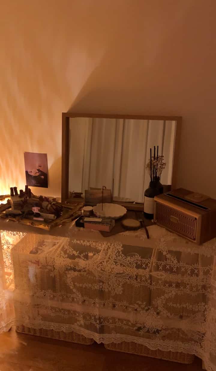 Cozy natural space with rattan baskets and lace tablecloth under warm golden lighting