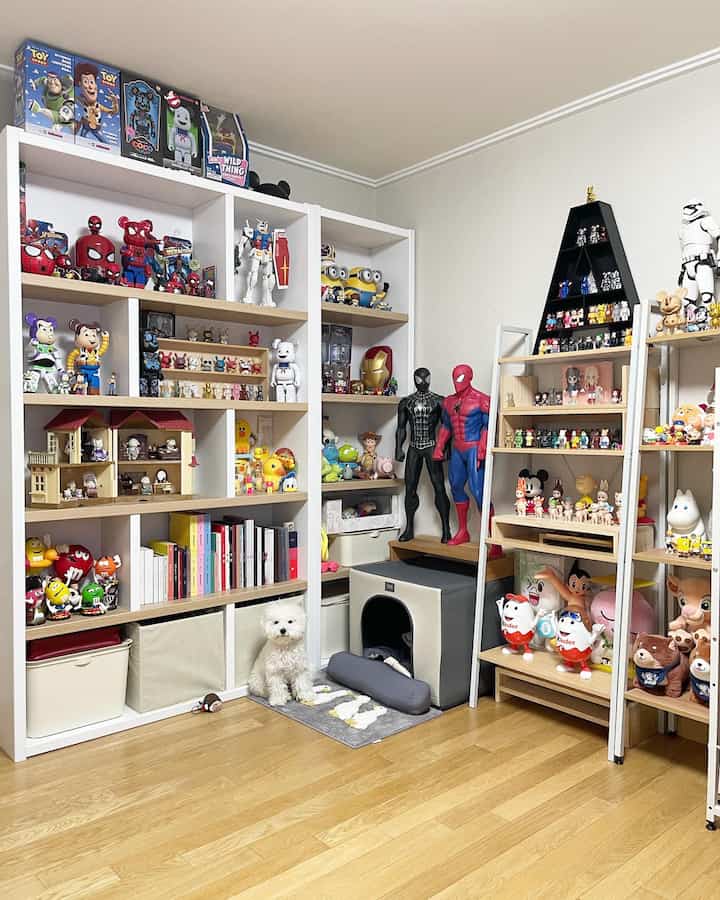 White and wood tone room featuring toy storage shelves and a pet house with a dog, creating a neat hobby space