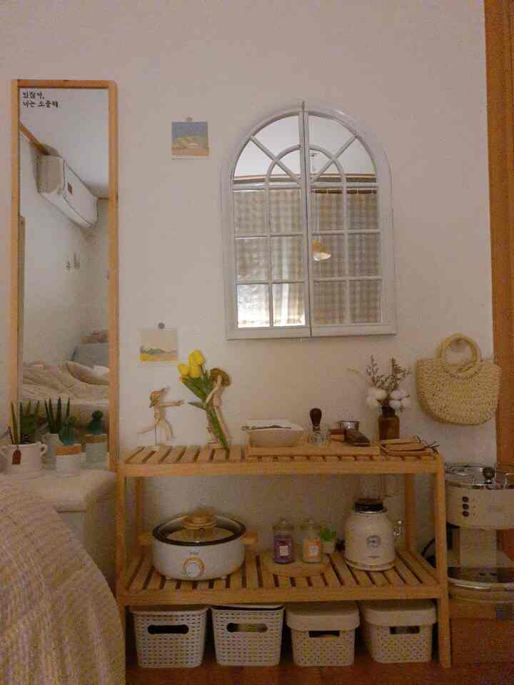Beige and wood tone studio photo zone featuring a wooden shelf, arched mirror, and rattan bag creating a warm atmosphere
