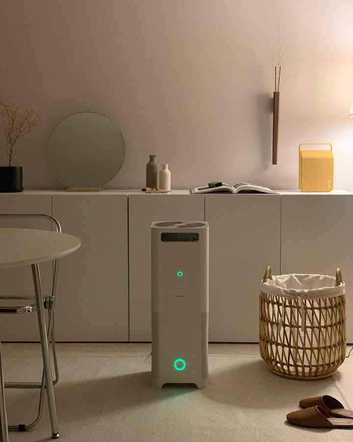 Natural modern toned 36-type Happy Housing living room featuring white storage cabinets and central air purifier creating a cozy atmosphere