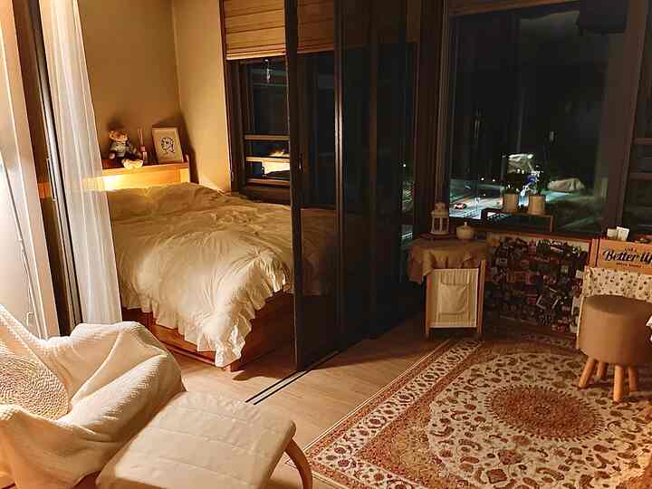 Warm beige-toned two-room officetel with bedroom and living area, cozy and comfortable interior space