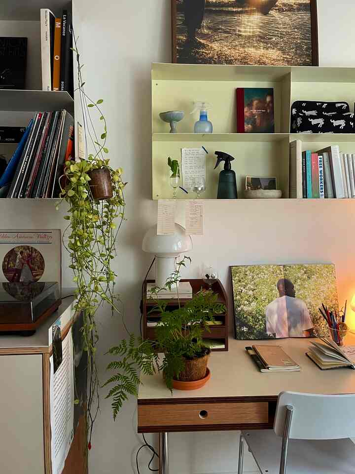 White and wood tone study space featuring a desk and plants with a natural atmosphere