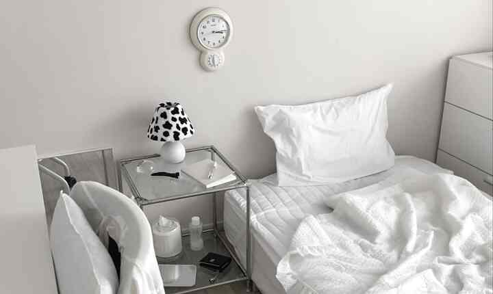 White-toned bedroom with single bed and transparent nightstand, featuring a clean and minimal atmosphere
