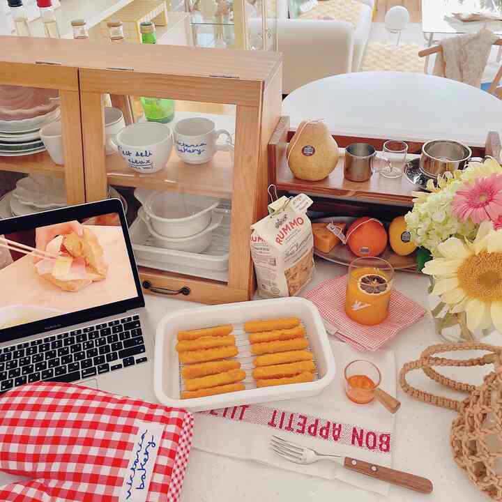 Natural wood tones and white in a dining room featuring snacks and home cafe items creating a cozy atmosphere
