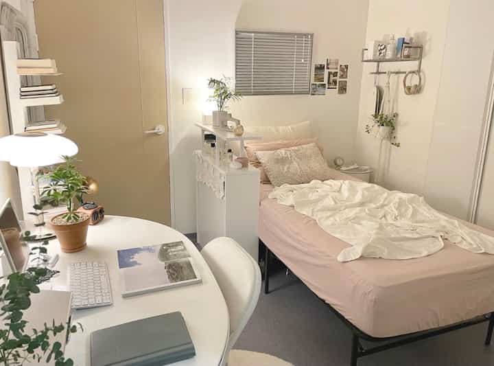Compact and cozy 3-pyeong bedroom featuring beige door and white furniture, with a single bed and home office desk setup