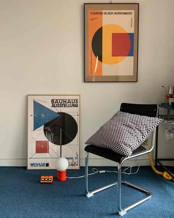 Blue rug space featuring a modern mid-century style black and white checkered cushion on a chair