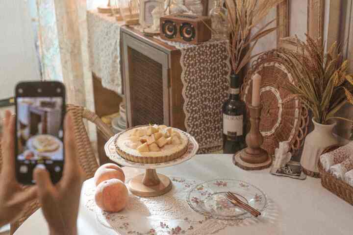 Cozy dining room in warm beige and brown tones featuring rattan chairs and vintage decor in a home cafe setting