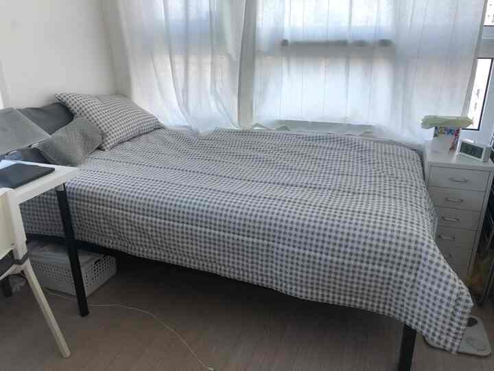 Modern 6-pyeong studio bedroom in white and gray tones featuring checkered bedding and white curtains