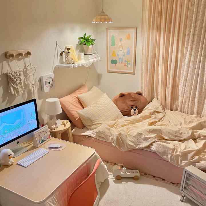 Ivory and pink toned bedroom featuring a bed, desk, and curtains creating a cozy natural style interior