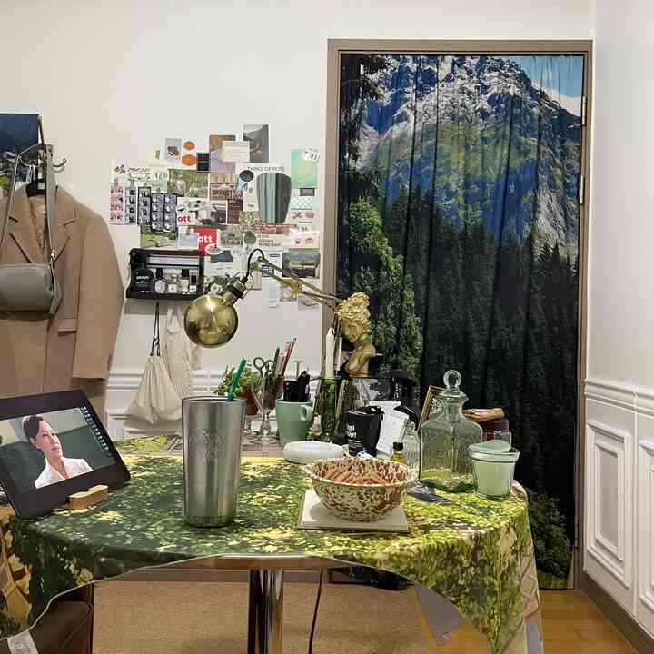 Natural small room featuring green forest print tablecloth and Switzerland mountain fabric curtain with cozy decor