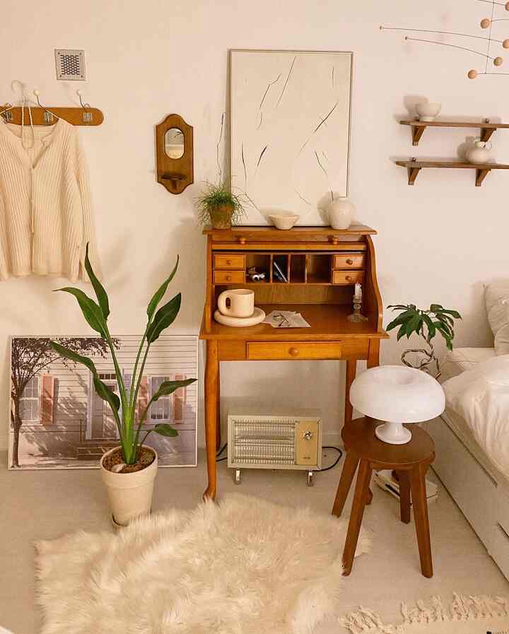 Warm wood and white-toned vintage small room featuring a cozy wooden desk and plants in a harmonious space