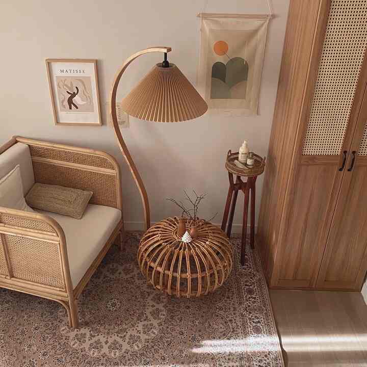 Cozy bedroom lounge with natural wood tones and rattan furniture elements