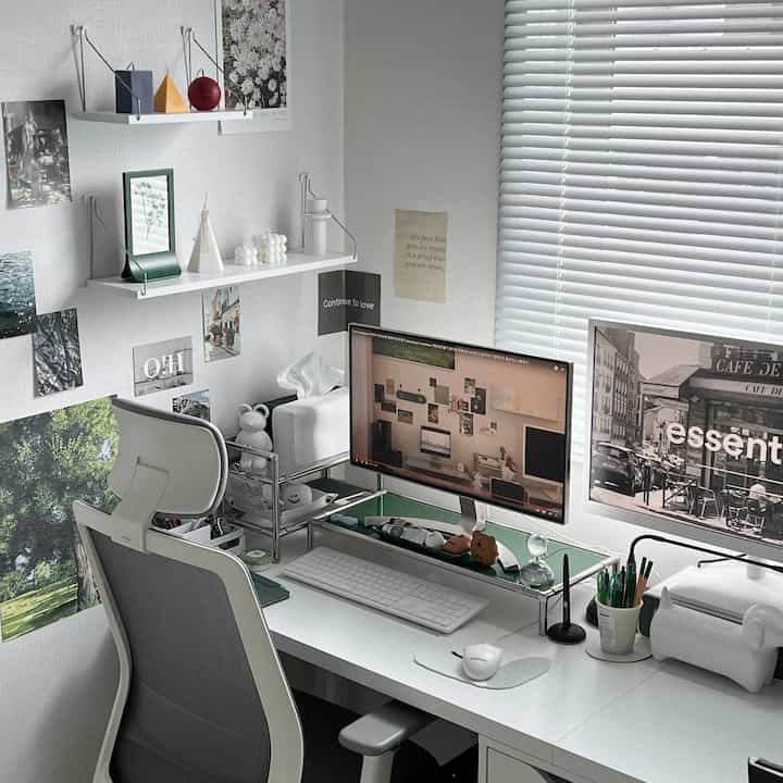 White-toned studio home office featuring monitors, gaming desk and chair in a simple modern workspace