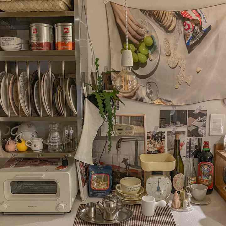 Vintage-style kitchen space, cozy home cafe zone featuring various kitchen utensils and a white toaster