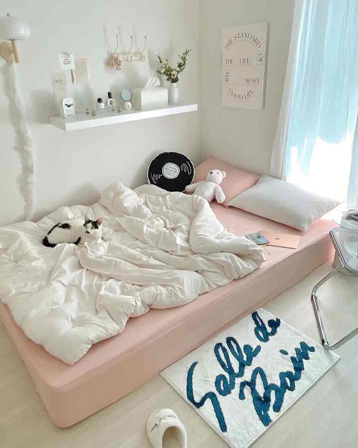 Ivory-toned bedroom featuring a pink mattress cover and ivory bedding creating a cozy atmosphere