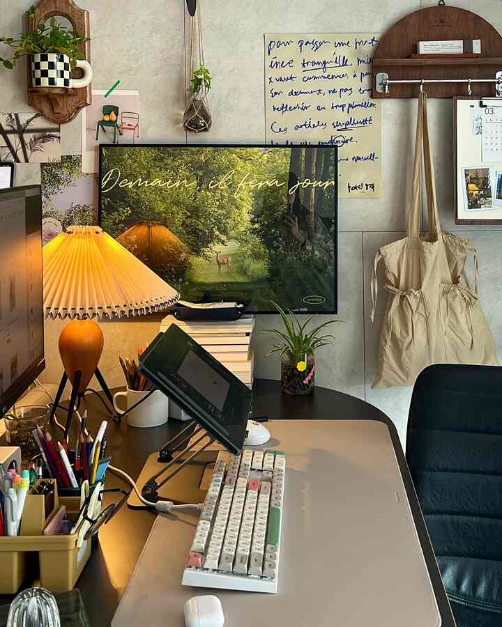 Ivory-toned compact home office featuring wooden accents, table lamp, and plants that create a cozy atmosphere.