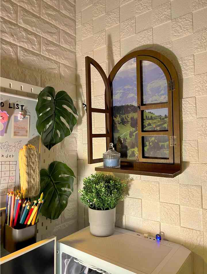 Bright white-toned compact space with a wooden arched window frame picture and green plants arranged in a cozy corner interior