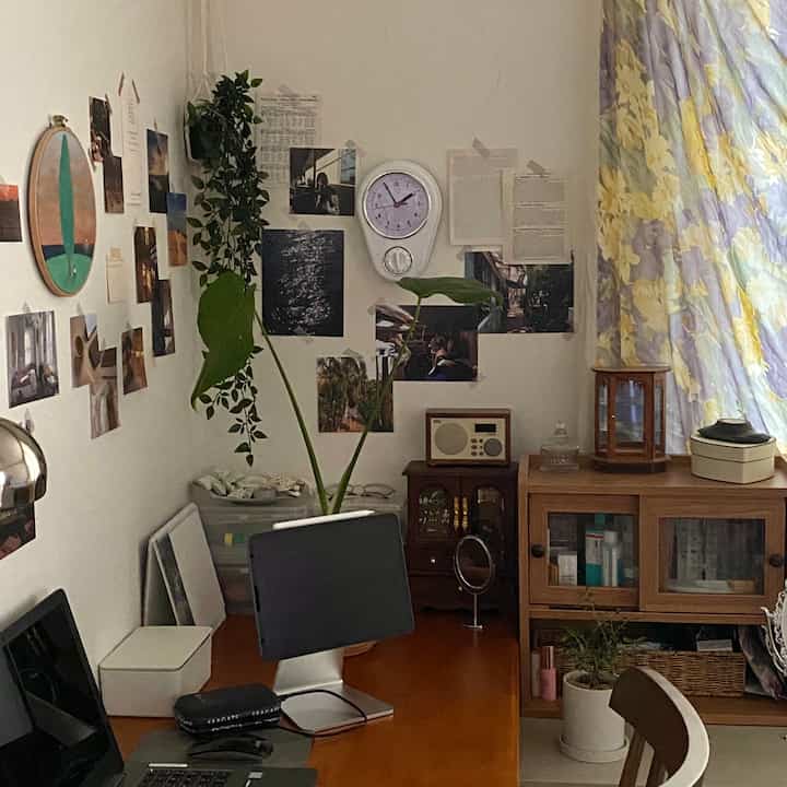 Natural color home office featuring a desk and cabinet with a cozy and functional workspace