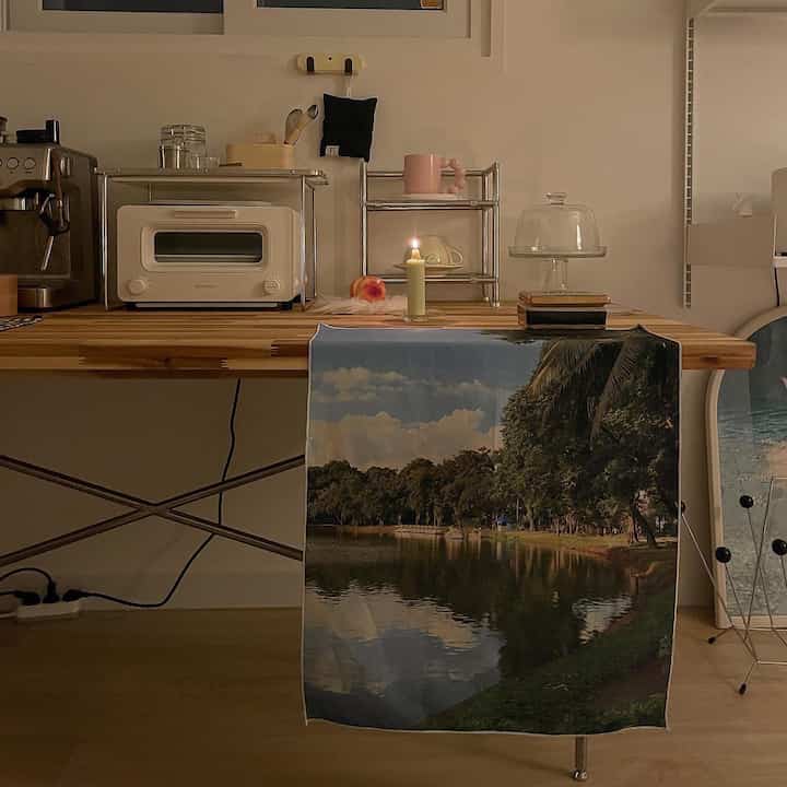 Minimal home cafe kitchen space with natural wood tones and white elements creating warm harmony