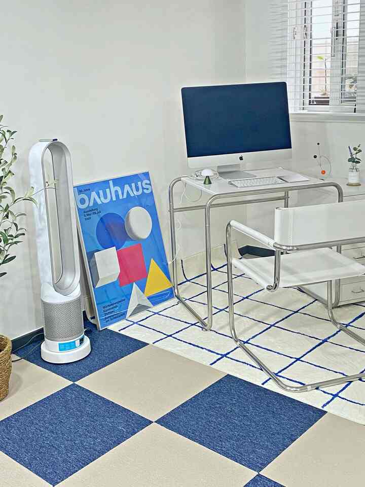 White and blue toned home office featuring aluminium frame desk and chair, checkered rug creating a clean and harmonious workspace