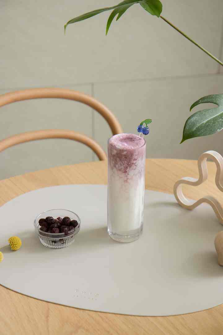 Light beige placemat on a kitchen table with a wooden table and curved chair, creating a classic and warm atmosphere