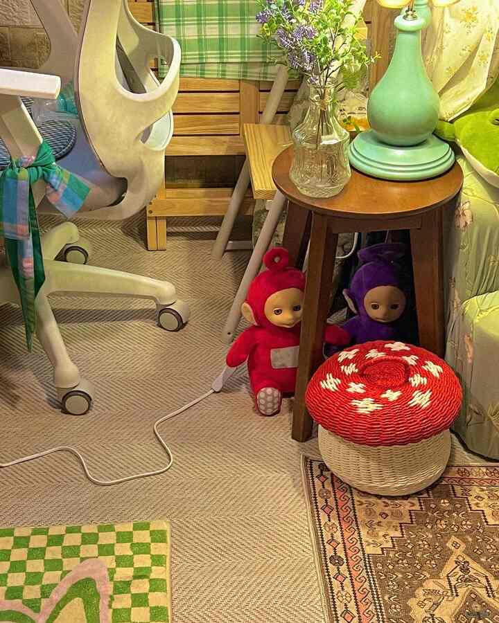 Natural toned compact small workspace featuring a white office chair and mushroom-shaped storage basket with warm interior accents