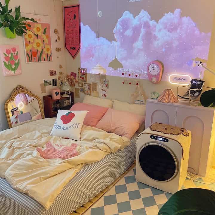 Cozy natural-toned bedroom featuring a bed, mini dryer, charming posters and clocks