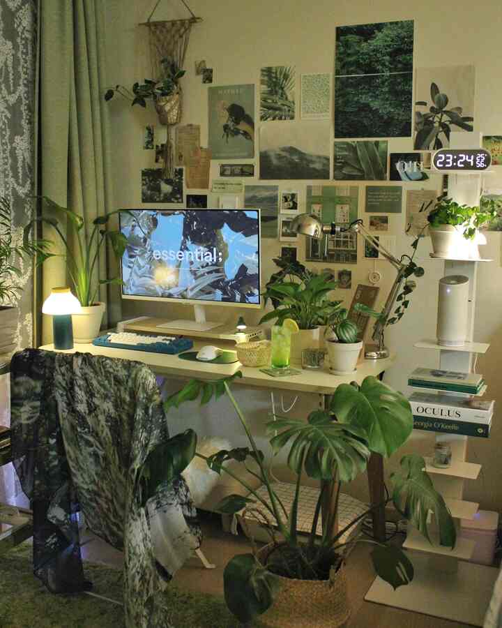 Natural-tone study featuring green leafy plants and a bright desk setup