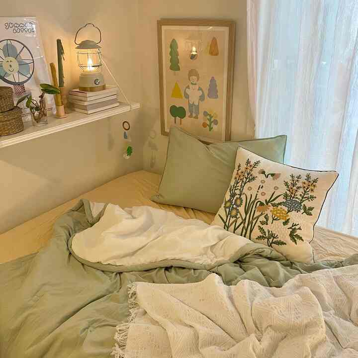 Natural color and white toned bedroom featuring cozy cushions and blankets with a warm atmosphere